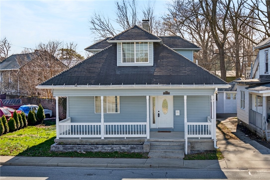 107 Riverside Drive Piqua, OH 45356 - Photo 1 of 69 This charming residence features a welcoming porch, perfect for enjoying outdoor moments and neighborhood views.