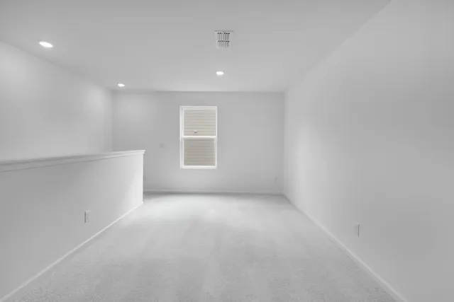 en empty room with windows