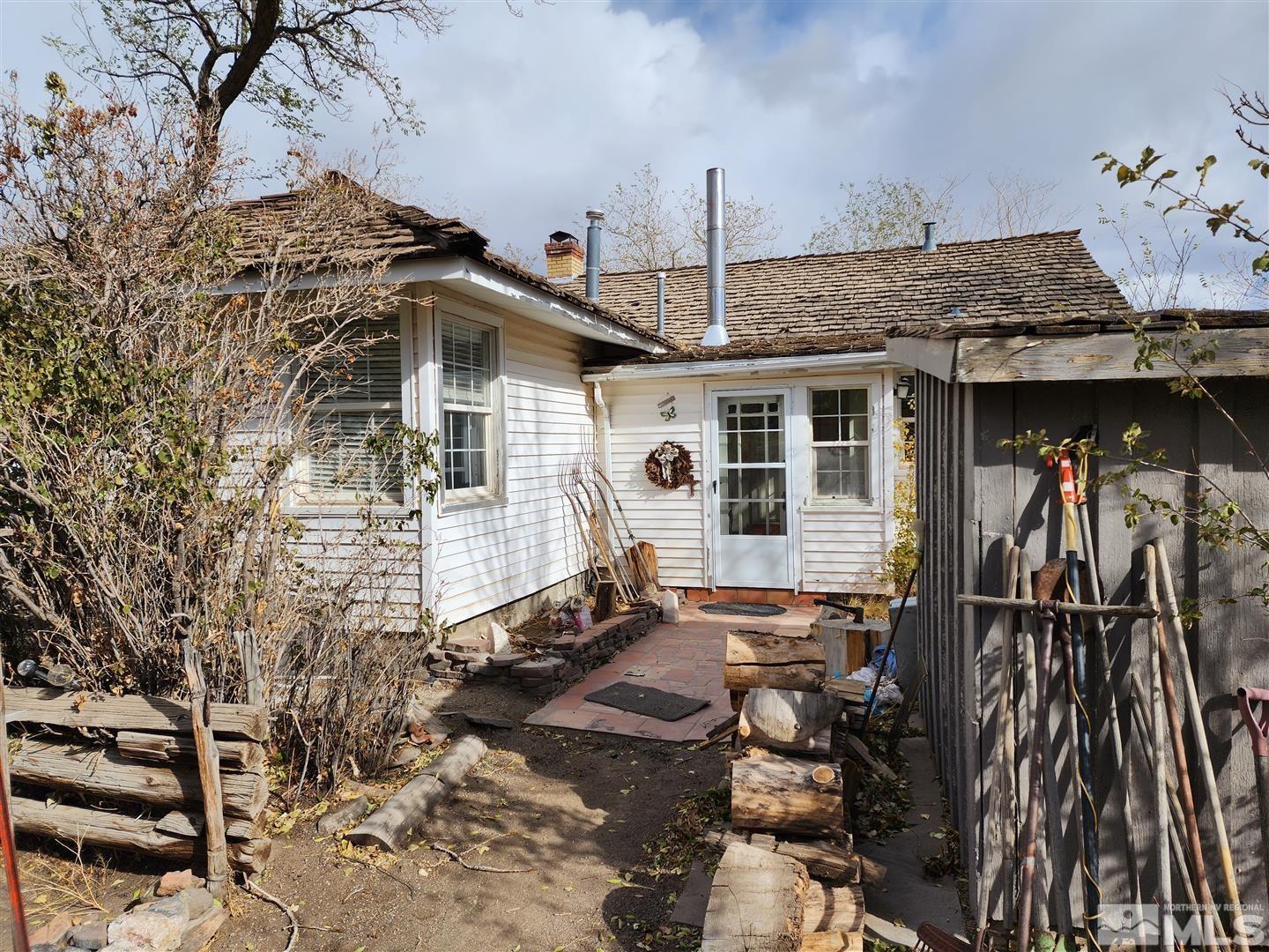 35 Highway 208 Yerington, NV 89447 - Photo 12 of 16 a front view of a house with parking space