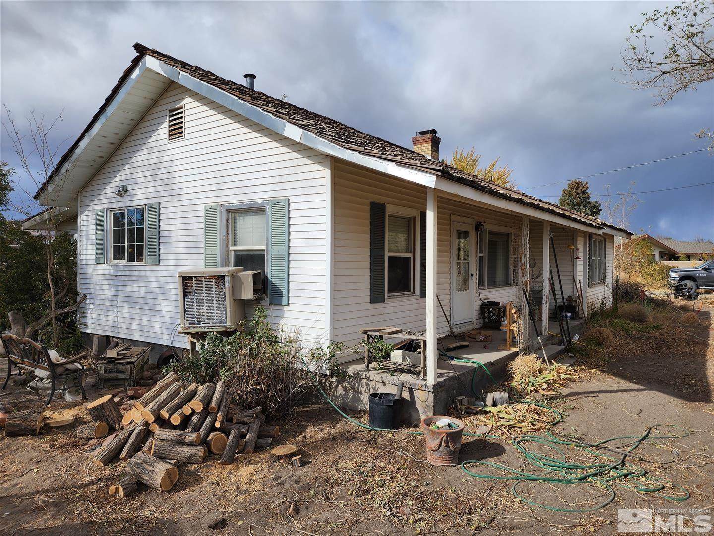 35 Highway 208 Yerington, NV 89447 - Photo 13 of 16 a front view of a house with patio