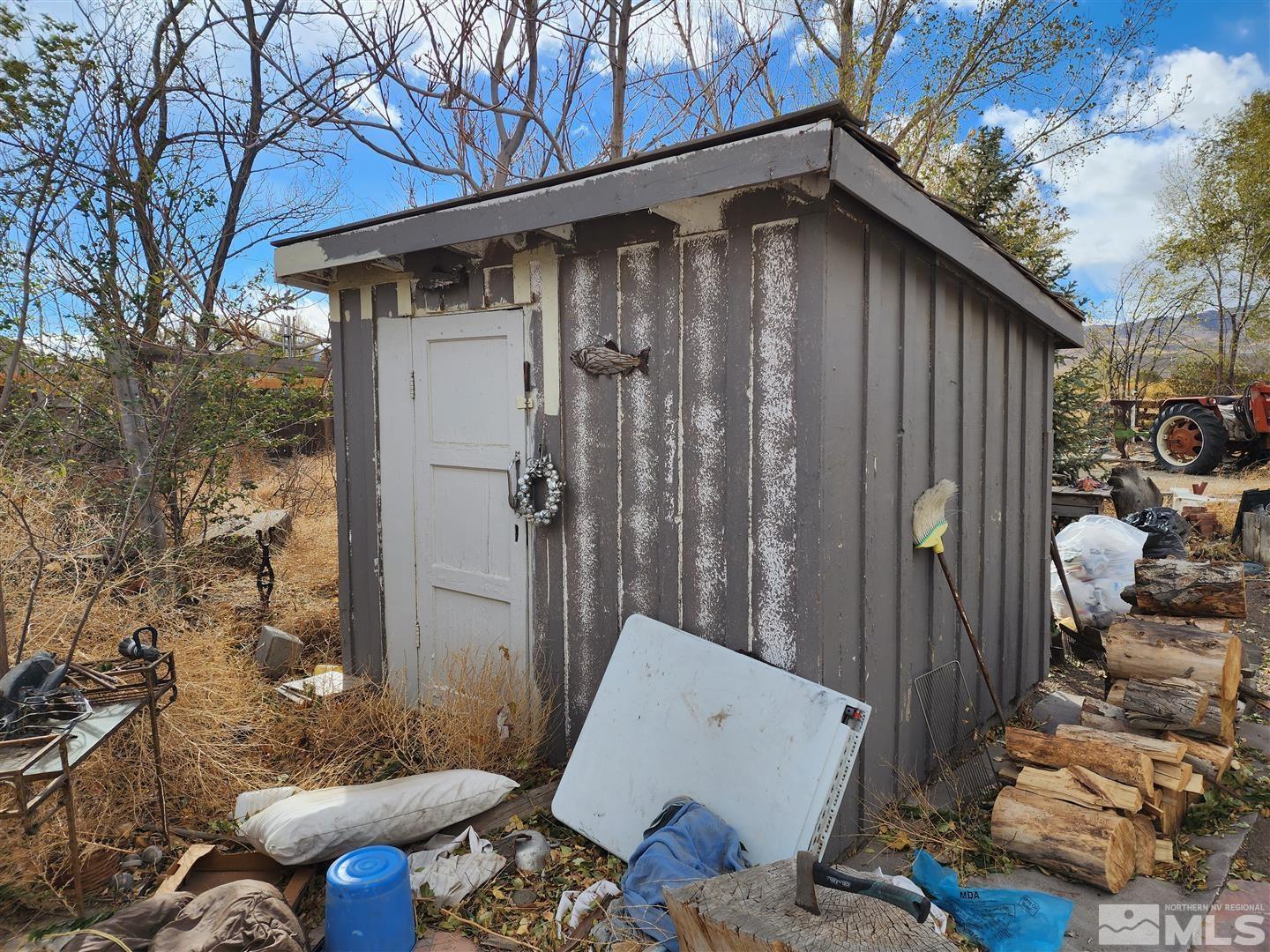 35 Highway 208 Yerington, NV 89447 - Photo 15 of 16 a backyard of a house with table and chairs