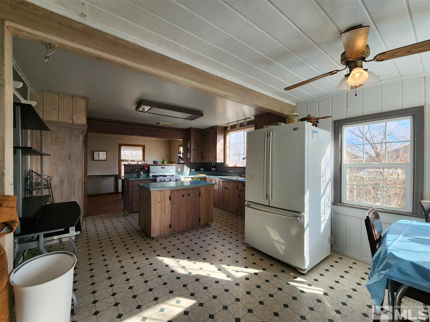 35 Highway 208 Yerington, NV 89447 - Photo 3 of 16 a kitchen with a refrigerator a sink and a stove