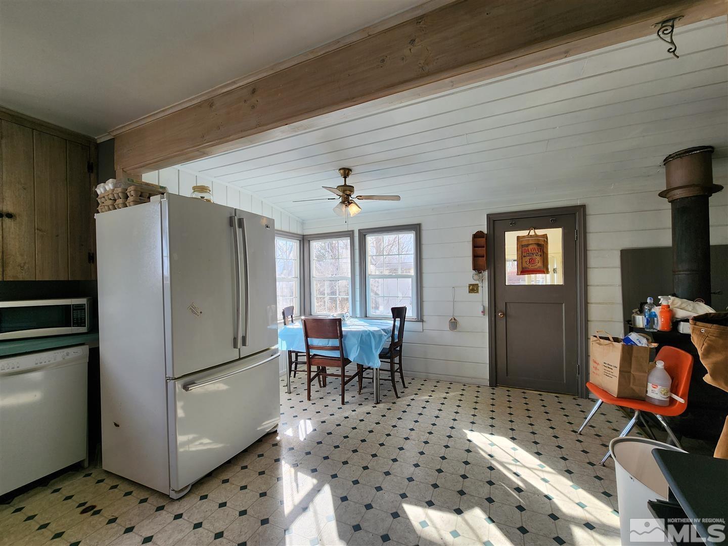 35 Highway 208 Yerington, NV 89447 - Photo 4 of 16 a dining room with furniture and a chandelier