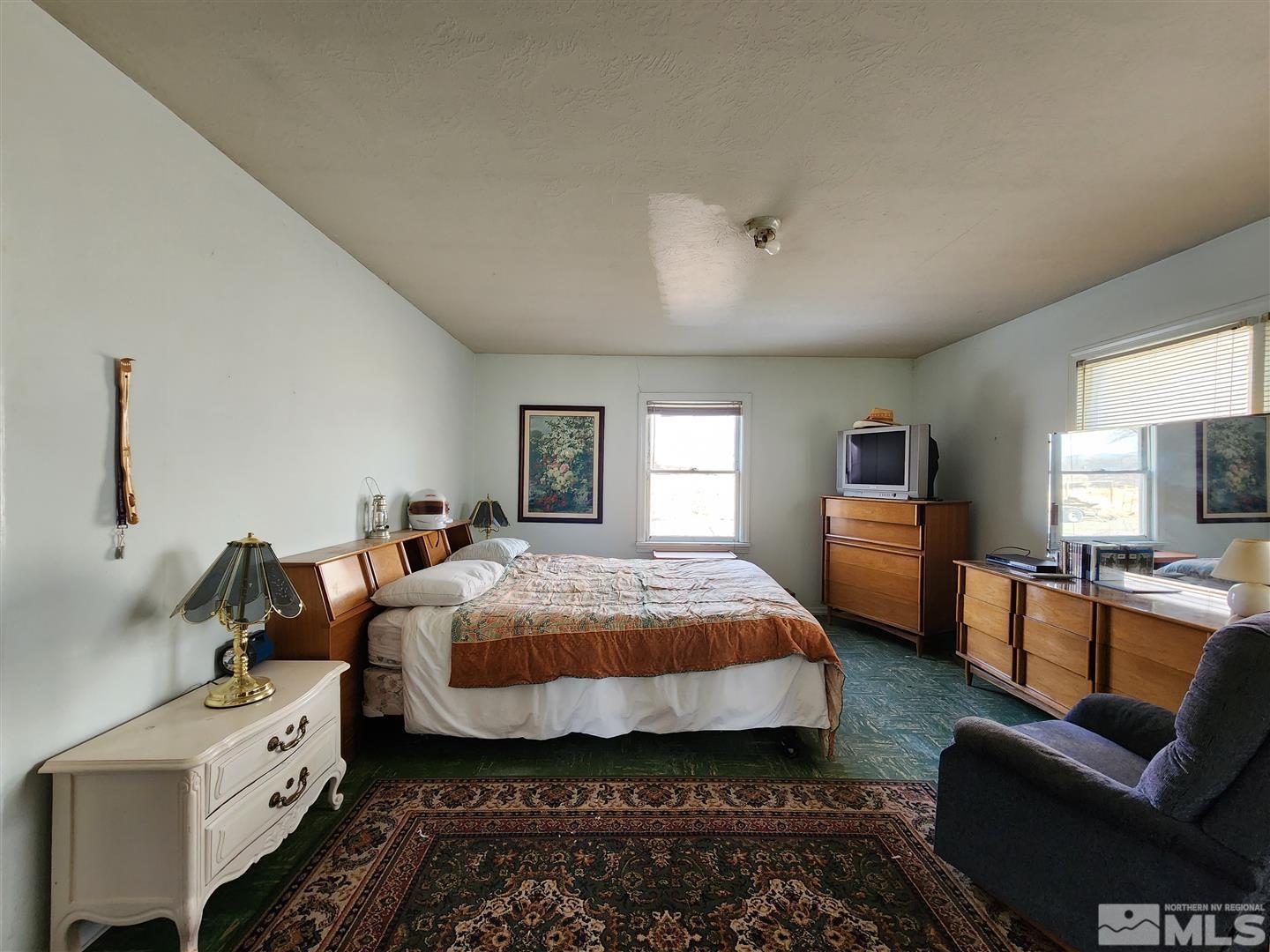 35 Highway 208 Yerington, NV 89447 - Photo 6 of 16 a bedroom with bed and window