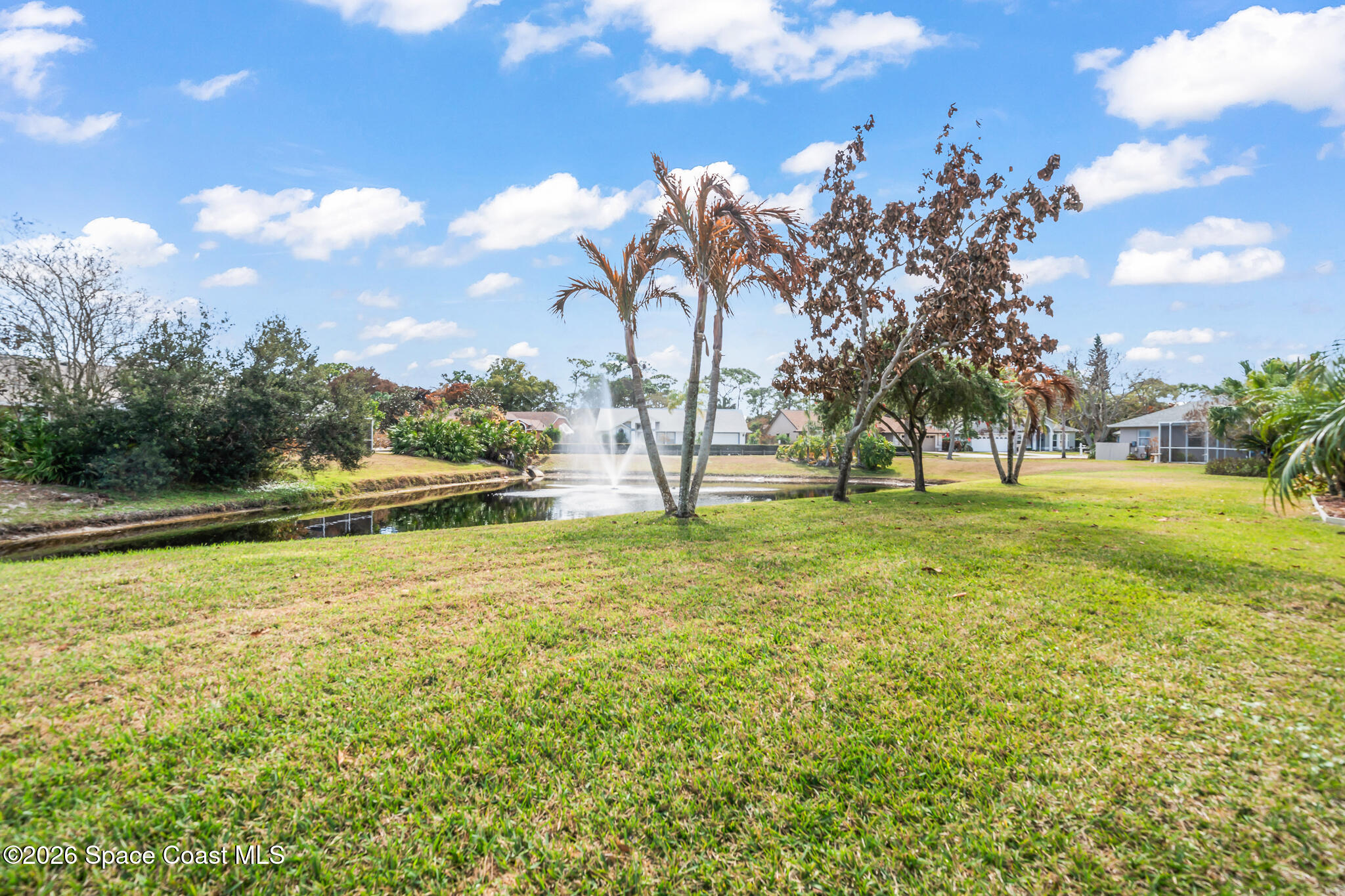 751 Lake Drive Melbourne, FL 32940 - Photo 13 of 36 Backyard with Pond