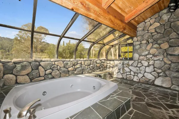 a bathroom with a bathtub and shower