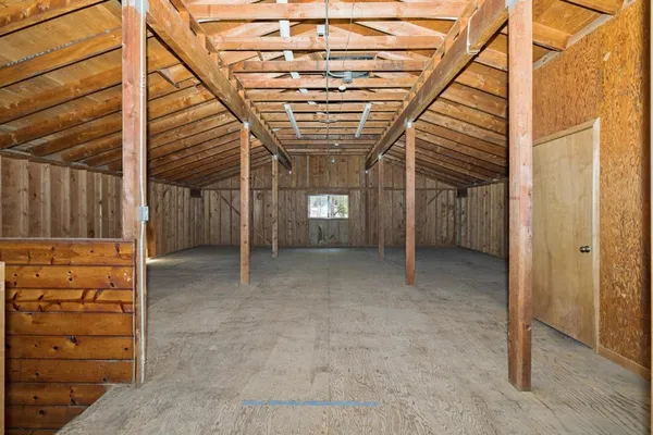 a view of an empty room with a windows
