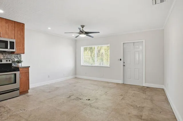 a view of an empty room with a window
