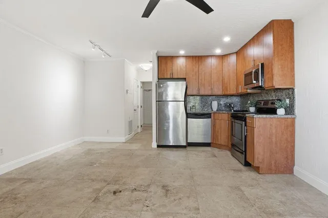 a view of kitchen with stainless steel appliances kitchen island