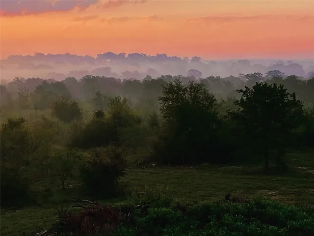 a view of a town with mountains in the background