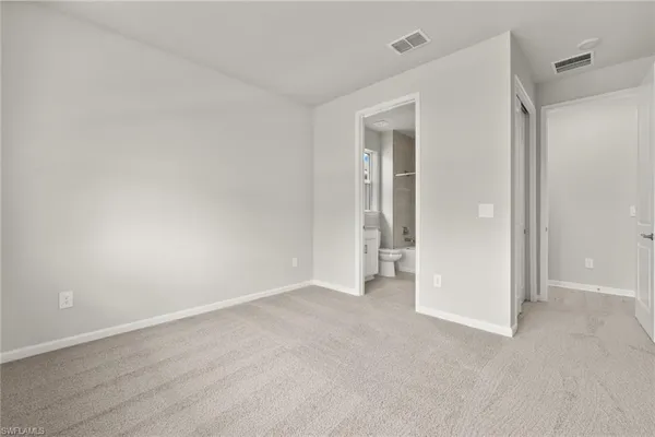 a large kitchen with stainless steel appliances granite countertop a large counter top and a wooden floors
