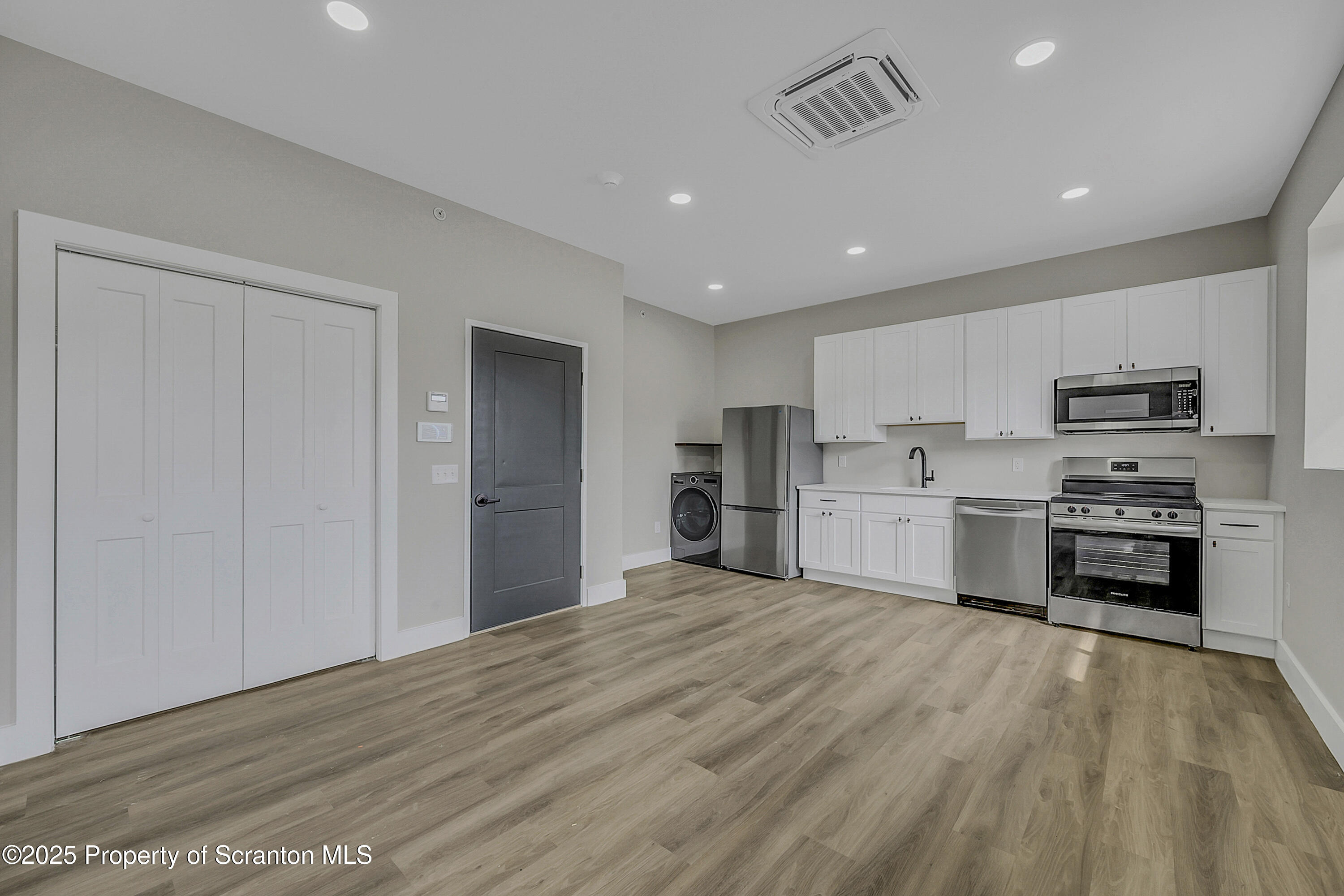 215 Hickory Street, Unit 8 Scranton, PA 18505 - Photo 13 of 18 a kitchen with stainless steel appliances a refrigerator and a stove top oven