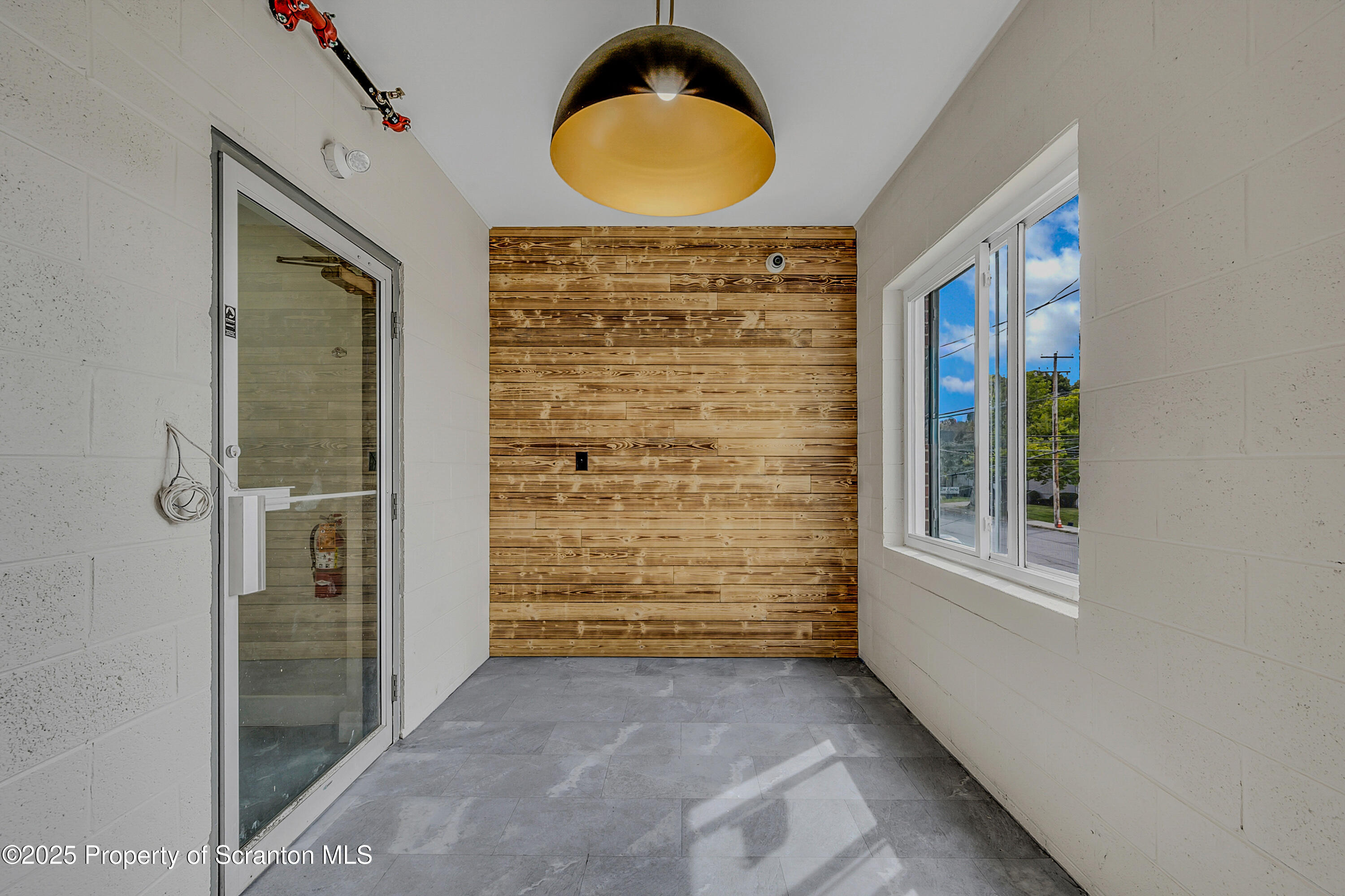 215 Hickory Street, Unit 8 Scranton, PA 18505 - Photo 2 of 18 an entryway view with wooden floor and windows