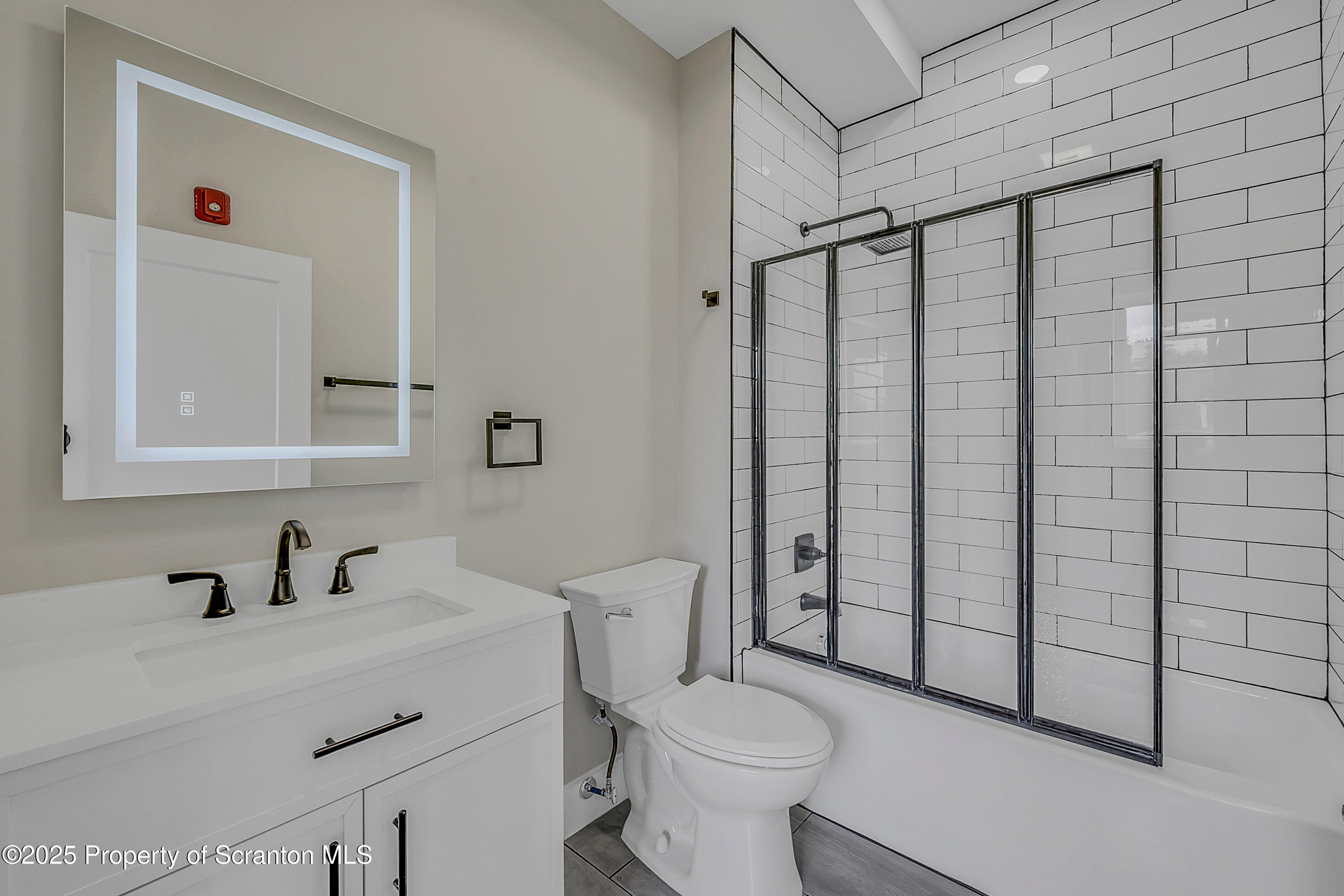 215 Hickory Street, Unit 8 Scranton, PA 18505 - Photo 6 of 18 a bathroom with a sink toilet and shower