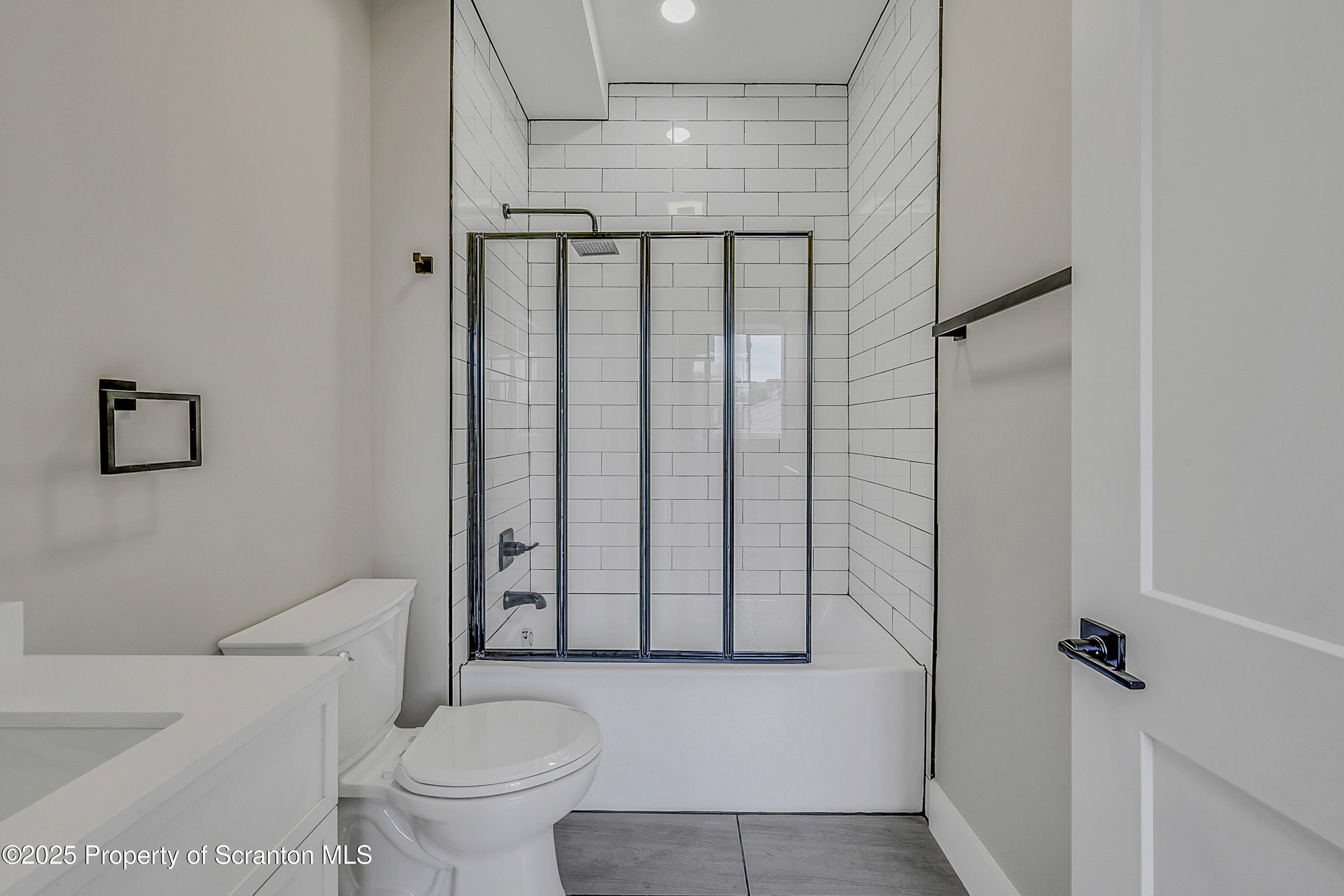215 Hickory Street, Unit 8 Scranton, PA 18505 - Photo 9 of 18 a bathroom with a toilet and a shower