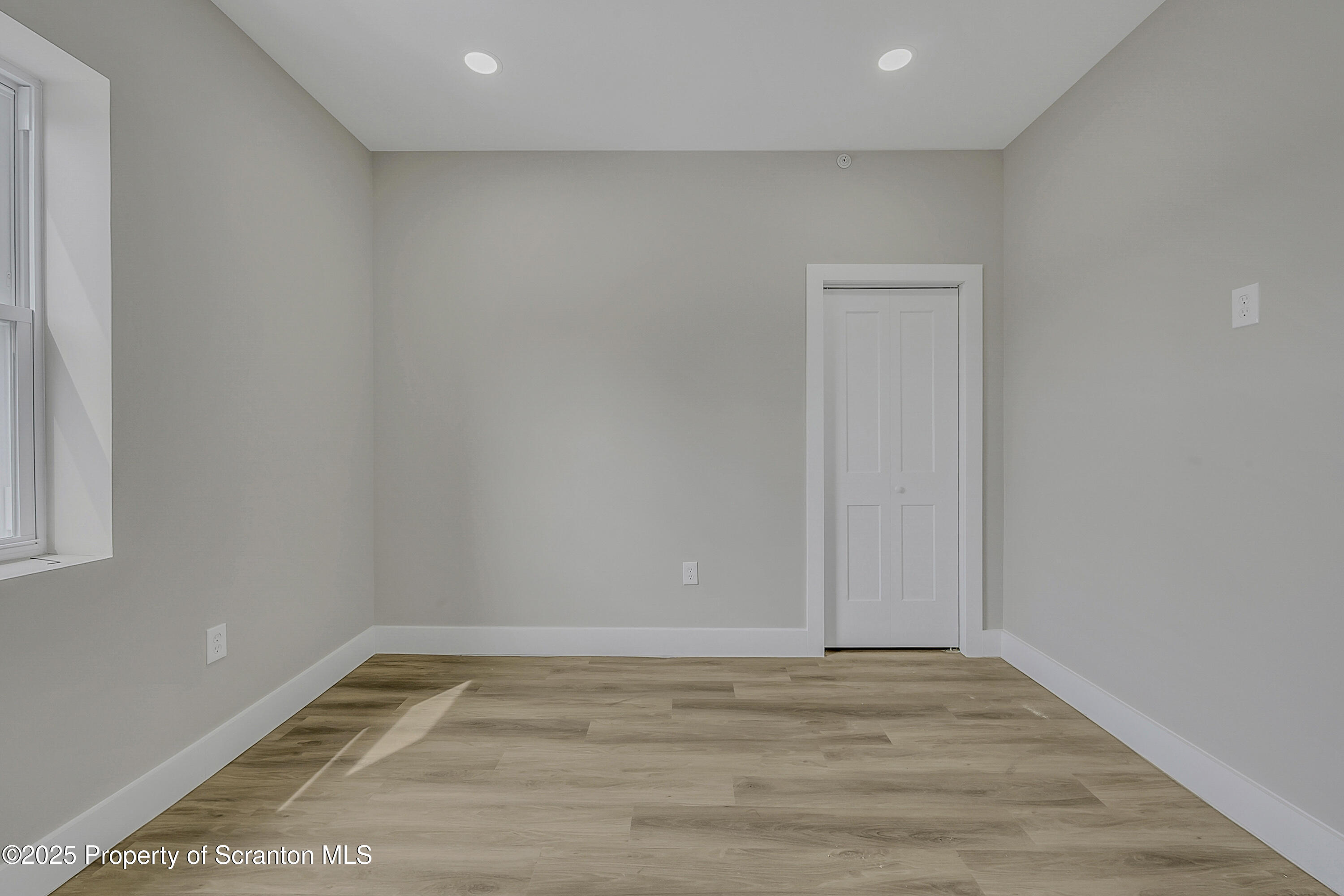 215 Hickory Street, Unit 8 Scranton, PA 18505 - Photo 10 of 18 a view of a room with wooden floor
