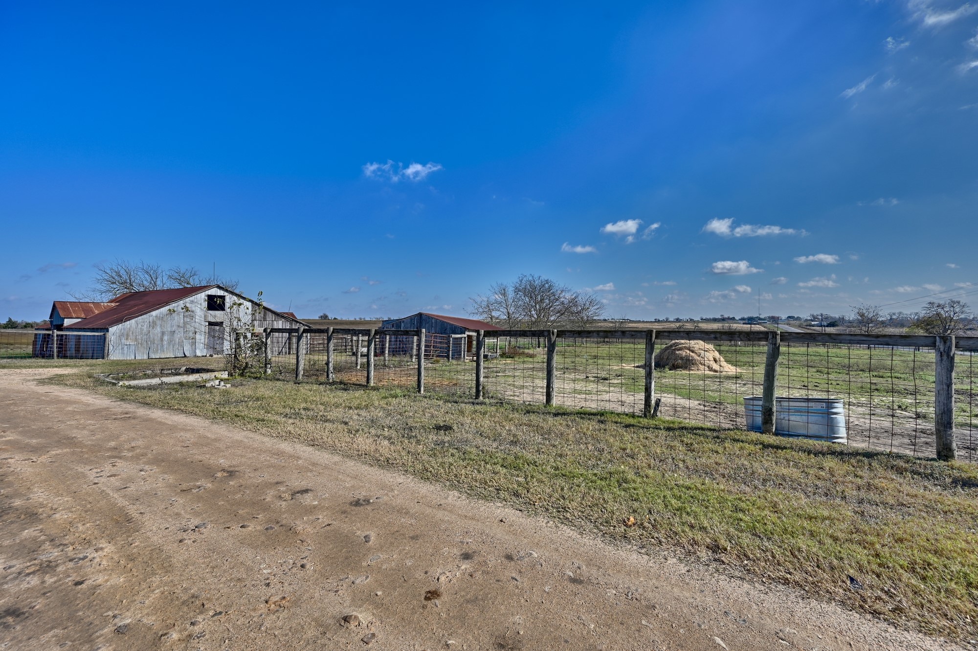 4898 FM 2502 Road Bleiblerville, TX 78931 - Photo 9 of 15 a view of a backyard with wooden fence
