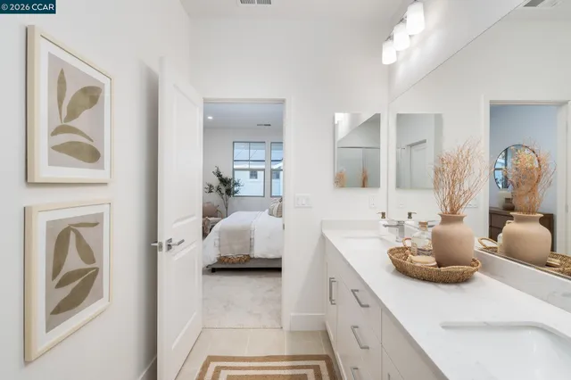 a bedroom with a bed and a mirror