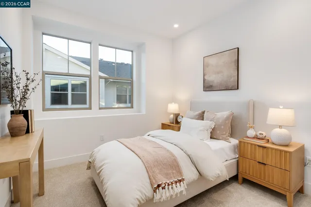 a bathroom with a double vanity sink toilet and shower
