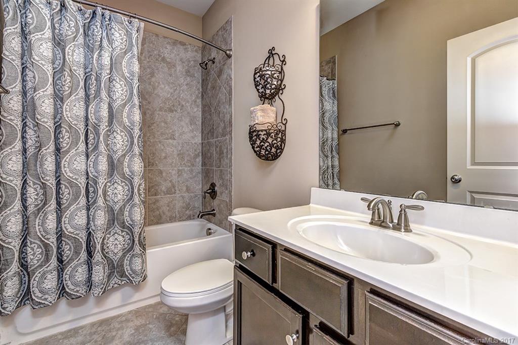 3032 Fallondale Road Waxhaw, NC 28173 - Photo 19 of 23 a bathroom with a sink toilet and shower