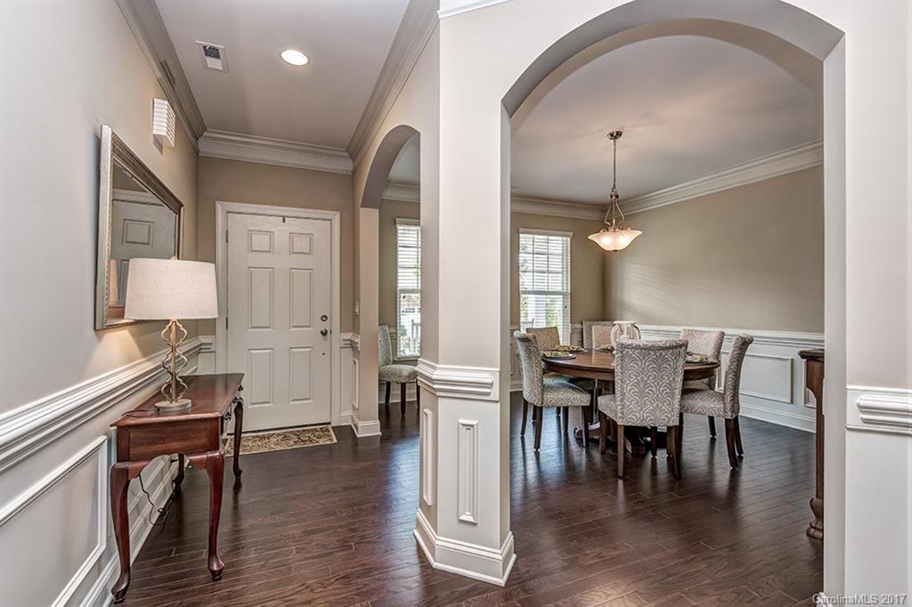 3032 Fallondale Road Waxhaw, NC 28173 - Photo 3 of 23 an open kitchen with dining table and wooden floor