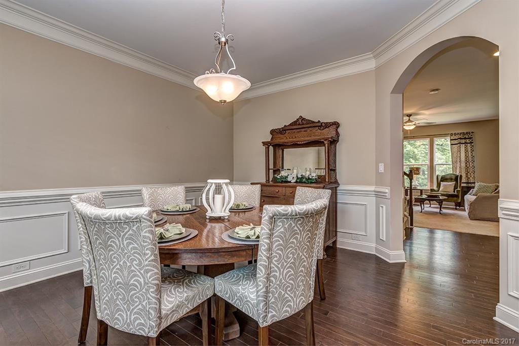 3032 Fallondale Road Waxhaw, NC 28173 - Photo 4 of 23 a view of a dining room with furniture wooden floor and chandelier