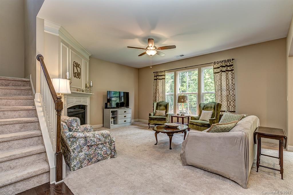 3032 Fallondale Road Waxhaw, NC 28173 - Photo 6 of 23 a living room with furniture a fireplace and a large window