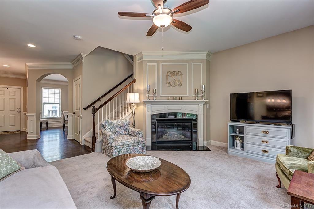 3032 Fallondale Road Waxhaw, NC 28173 - Photo 7 of 23 a living room with furniture a flat screen tv and a fireplace