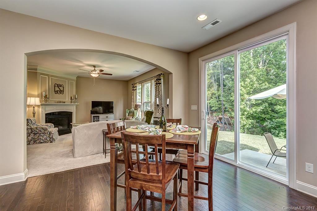 3032 Fallondale Road Waxhaw, NC 28173 - Photo 10 of 23 a view of a dining room with furniture window and wooden floor