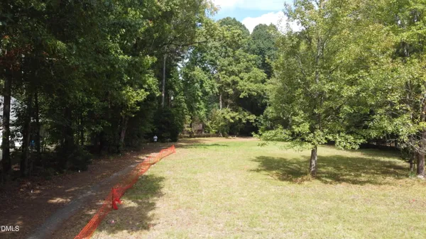 a view of a yard with swimming pool