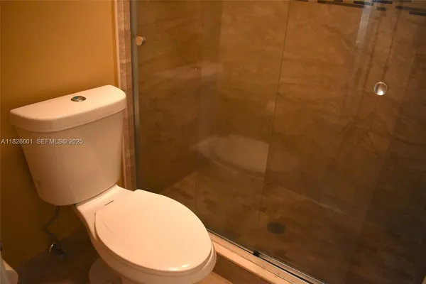 a bathroom with a toilet and a sink