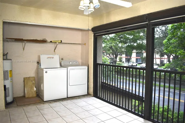 a view of a room with dryer and washer