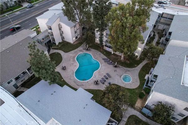 an aerial view of a house roof deck with furniture and a potted plant