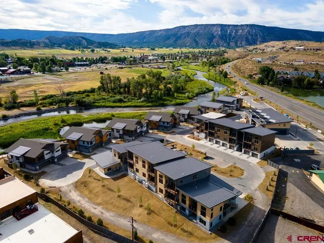 an aerial view of residential house with outdoor space and swimming pool