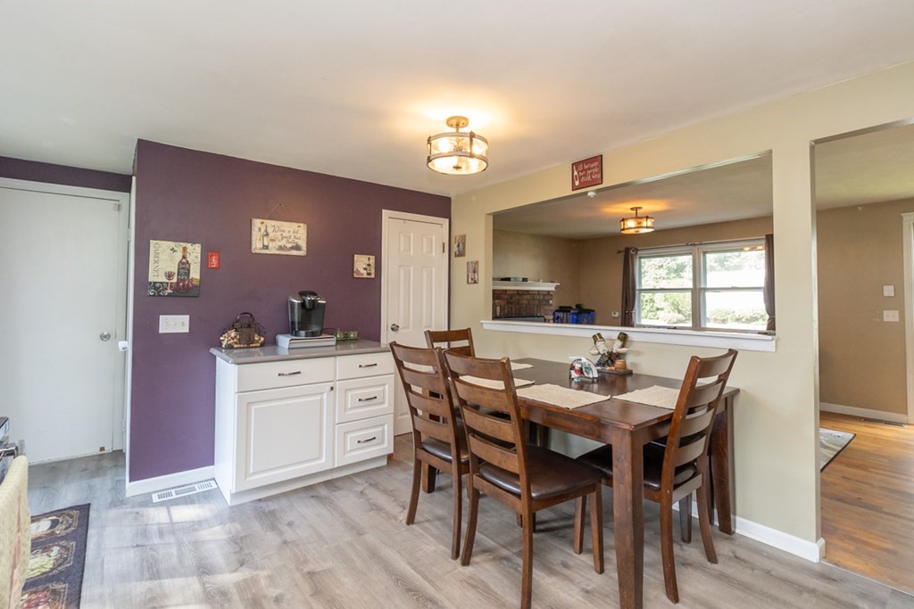206 Pine Acre Road Springfield, MA 01129 - Photo 11 of 25 a view of a dining room with furniture and wooden floor