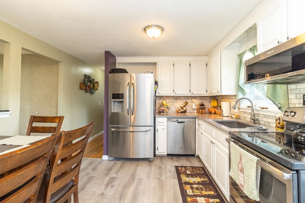206 Pine Acre Road Springfield, MA 01129 - Photo 12 of 25 a kitchen with granite countertop a refrigerator stove top oven and sink