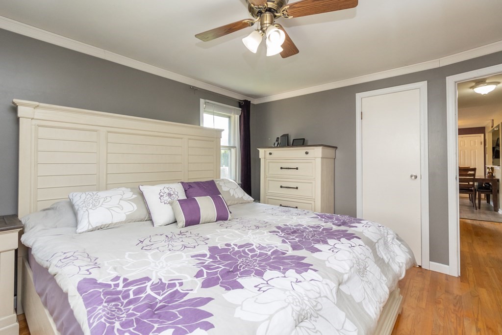 206 Pine Acre Road Springfield, MA 01129 - Photo 14 of 25 a bedroom with a bed and a chandelier
