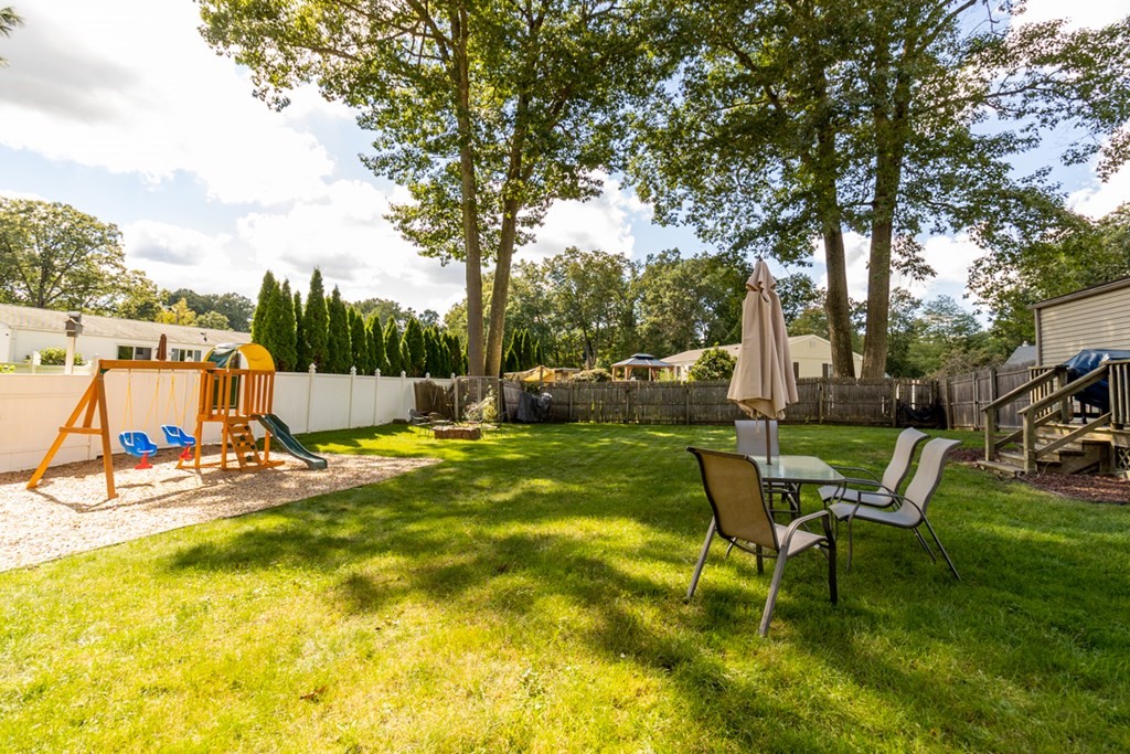 206 Pine Acre Road Springfield, MA 01129 - Photo 24 of 25 a view of a swimming pool with a bench and trees around