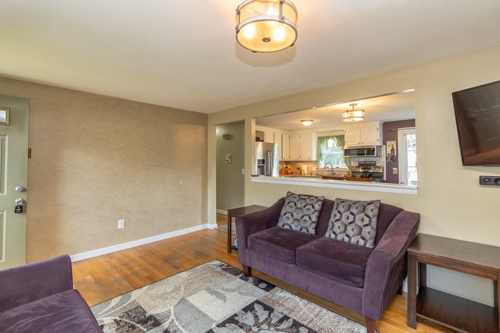 206 Pine Acre Road Springfield, MA 01129 - Photo 7 of 25 a living room with furniture and a flat screen tv