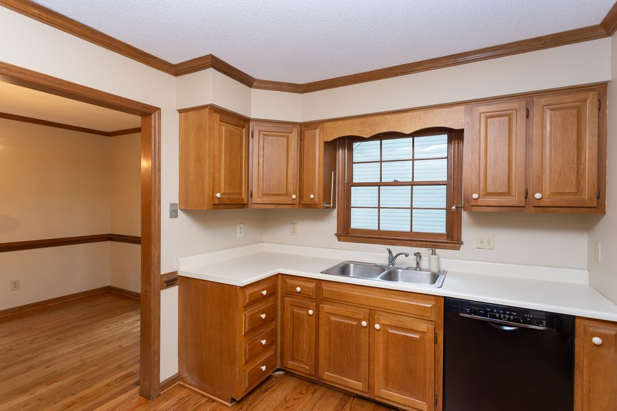 6917 Sandringham Drive Raleigh, NC 27613 - Photo 7 of 25 How nice to be doing dishes while looking out your window! Kitchen with window!
