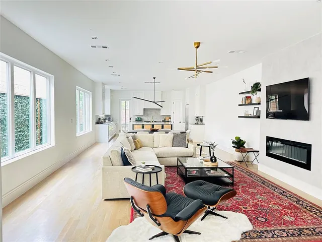 a dining table with chairs and window