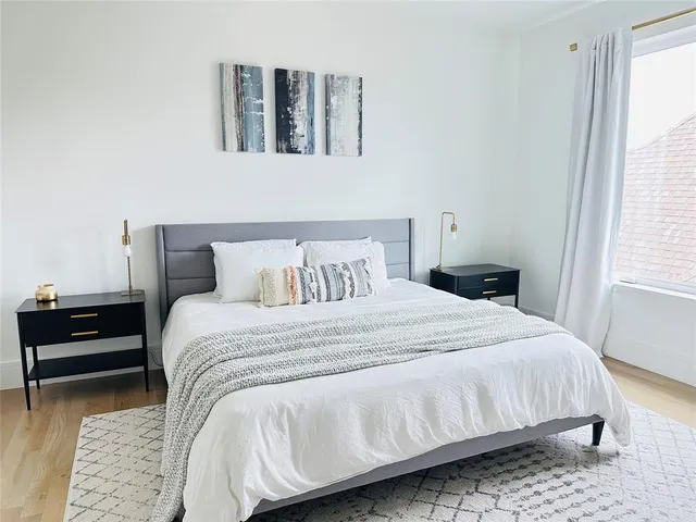 a living room with fireplace furniture and a flat screen tv
