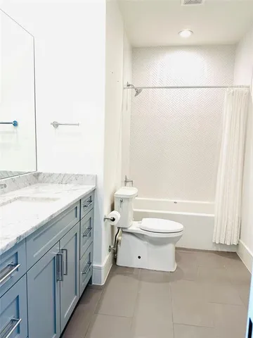 a view of a livingroom with furniture and a window