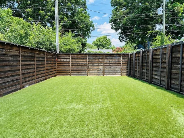 a outdoor space with a table and chairs