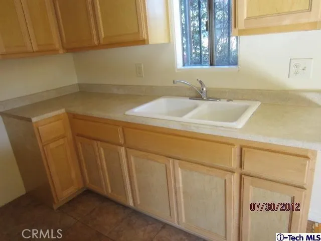 a bathroom with a sink and cabinets