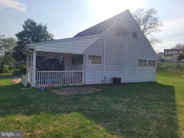 a porch with a yard