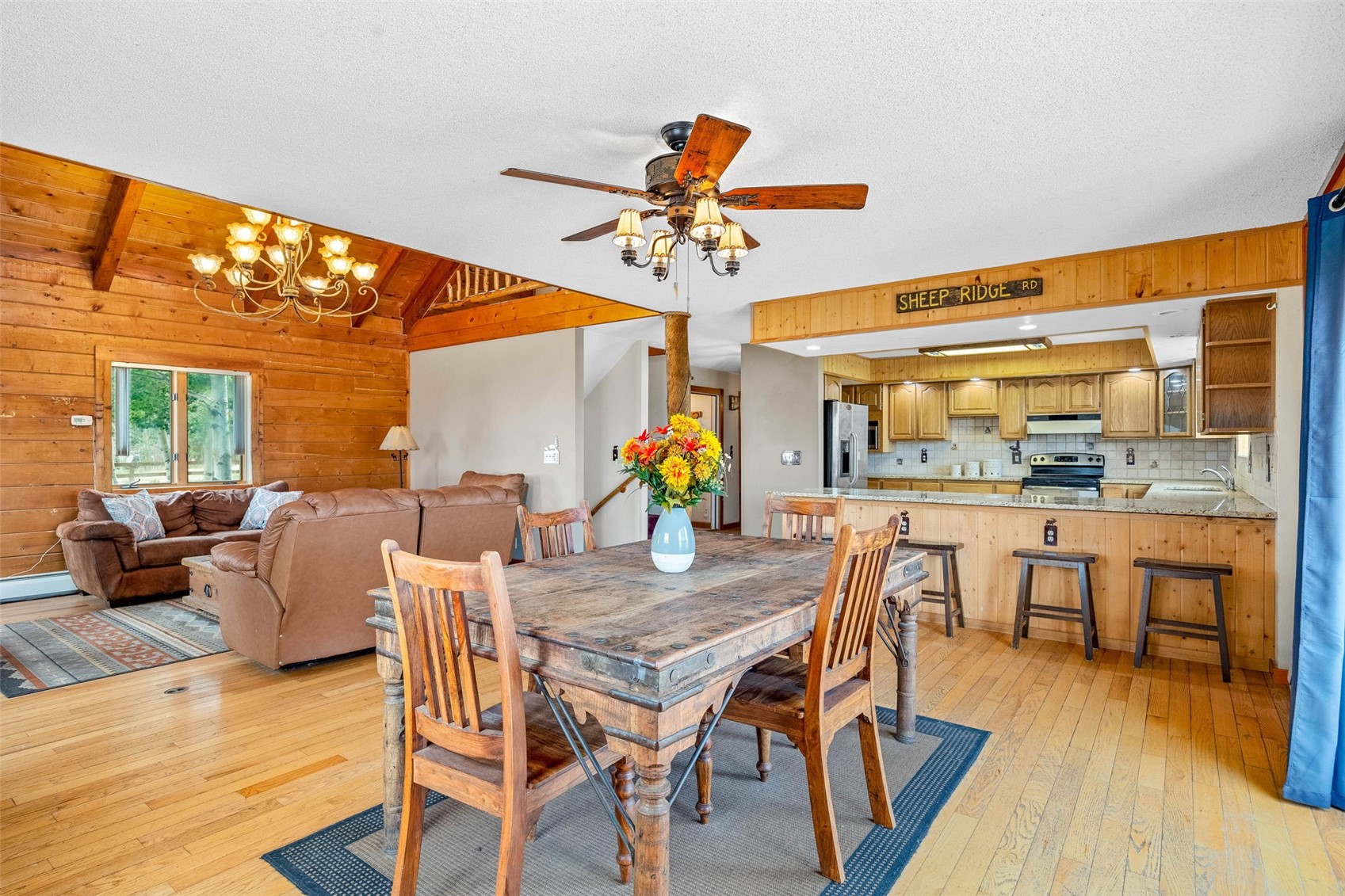 597 Sheep Ridge Road Fairplay, CO 80440 - Photo 10 of 50 a view of a dining room with furniture window and wooden floor