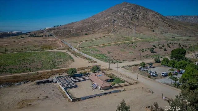 a view of a backyard with chairs