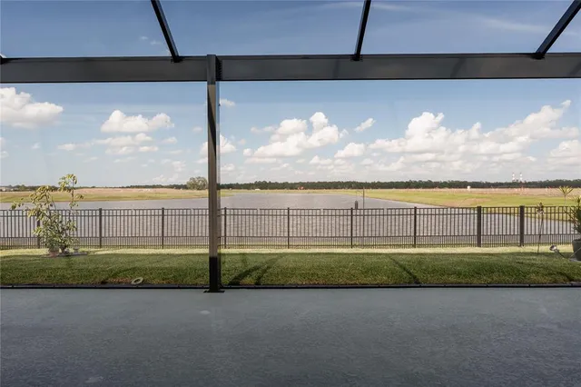 a view of swimming pool with an outdoor seating