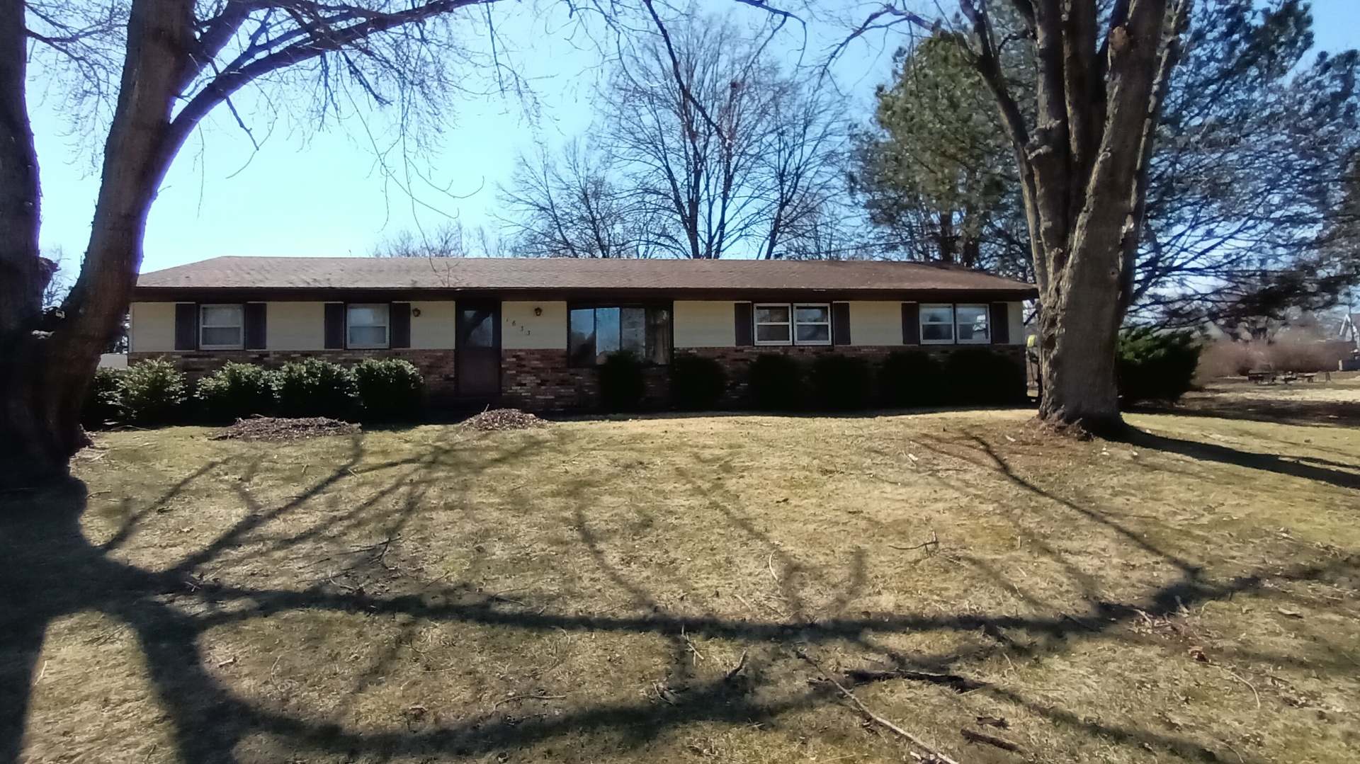 a view of house with yard